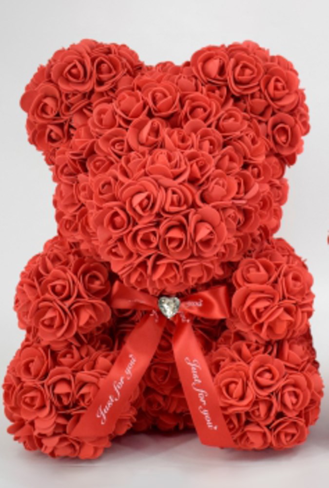 15-inch teddy bear made of densely packed red foam roses with a red ribbon bow featuring a small rhinestone heart in the.