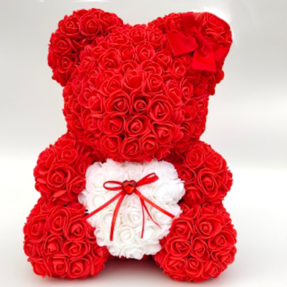 15in teddy bear made of red foam roses with white foam rose heart and red bow on ear.