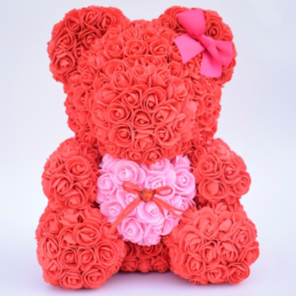 15-inch red teddy bear made of foam roses holding a pink heart with a ribbon bow on its ear.