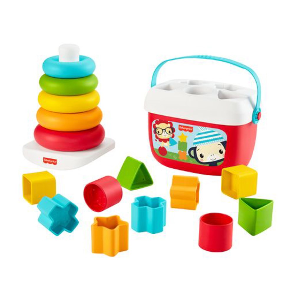 Colorful plastic stacking rings with red base and white post, plus red and white shape sorter bucket with blue handle and.
