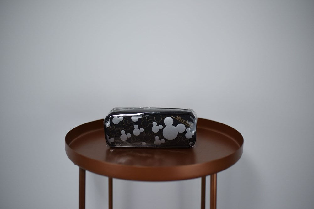 Black rectangular pencil pouch with white Mickey Mouse head silhouettes and a zipper closure.