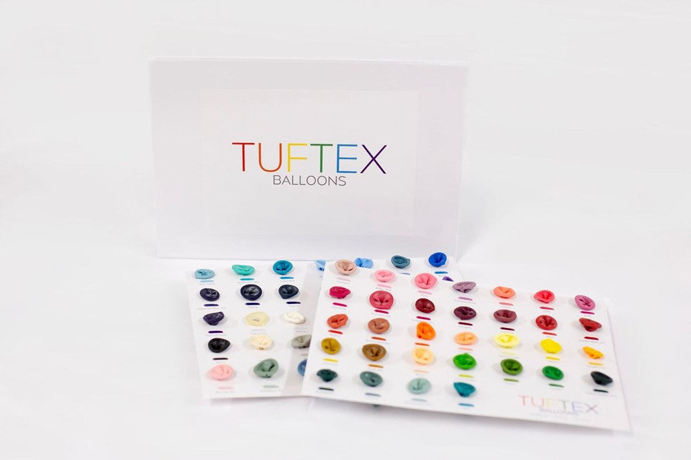 White display folder labeled Tuftex Balloons with two color sample sheets showing various glossy balloon colors arranged in.