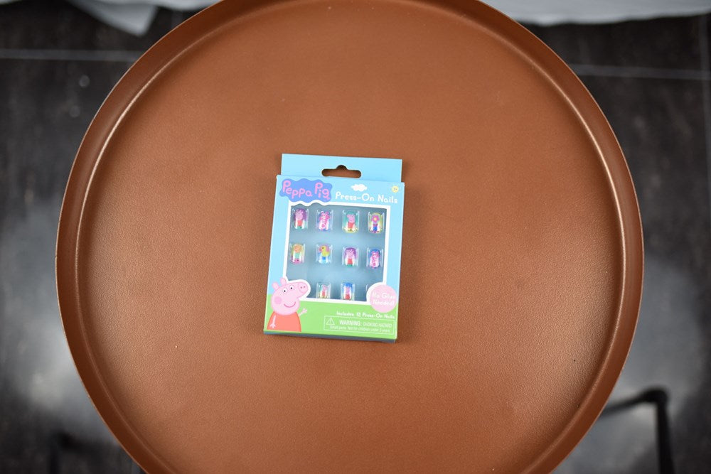 Peppa Pig-themed fake nails set with colorful cartoon designs, twelve-pack packaging.