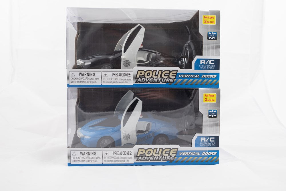 Two battery-operated RC police cars, one black and one white, each in clear display packaging with open doors and blue and.