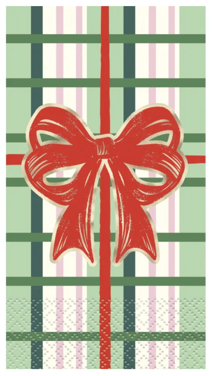 Green and white plaid napkin with red ribbon and bow design, vintage Christmas style.