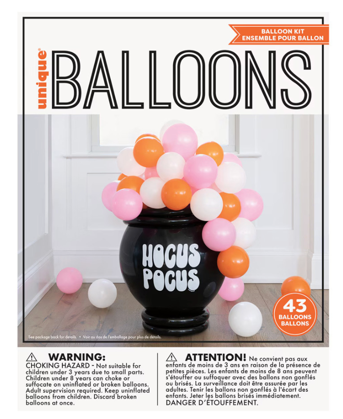 Black cauldron-shaped balloon with "Hocus Pocus" text surrounded by orange, pink, and white balloons.