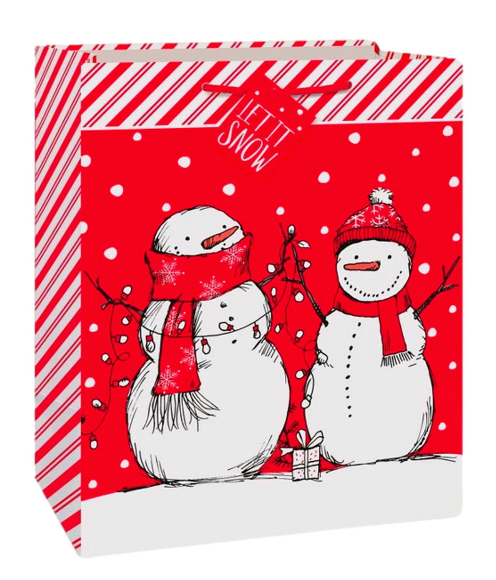 Red gift bag with two smiling snowmen wearing red scarves and hats, white snowflakes, and diagonal candy cane stripes on.