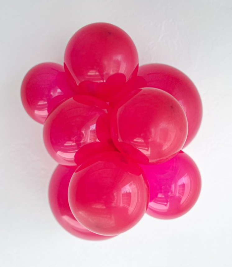 Cluster of shiny crystal magenta latex balloons, 17 inches, glossy finish, round shape.
