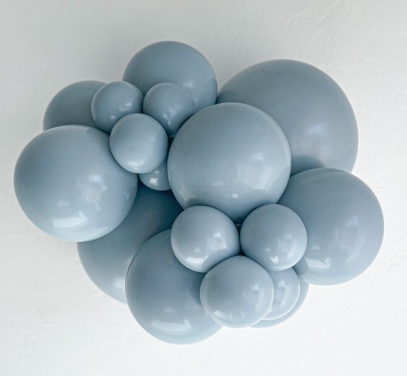 Cluster of matte fog blue latex balloons in various sizes arranged in a decorative garland style.