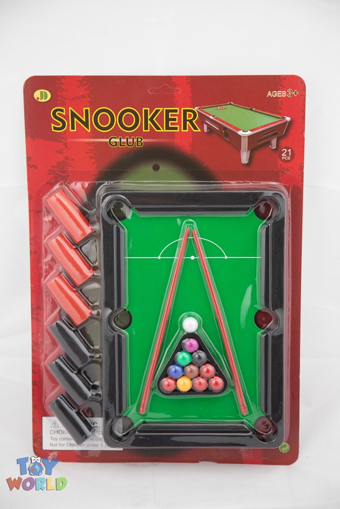 Miniature green pool table with triangular rack, colorful balls, two red cues, and black pockets in red blister card.