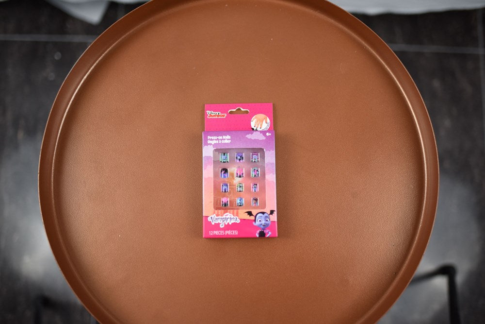 Pack of 12 Vampirina-themed press-on nails with purple and pink designs, displayed on pink card packaging.