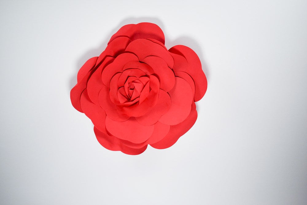 Large 20-inch red decorative wall flower with layered rounded petals in matte finish.