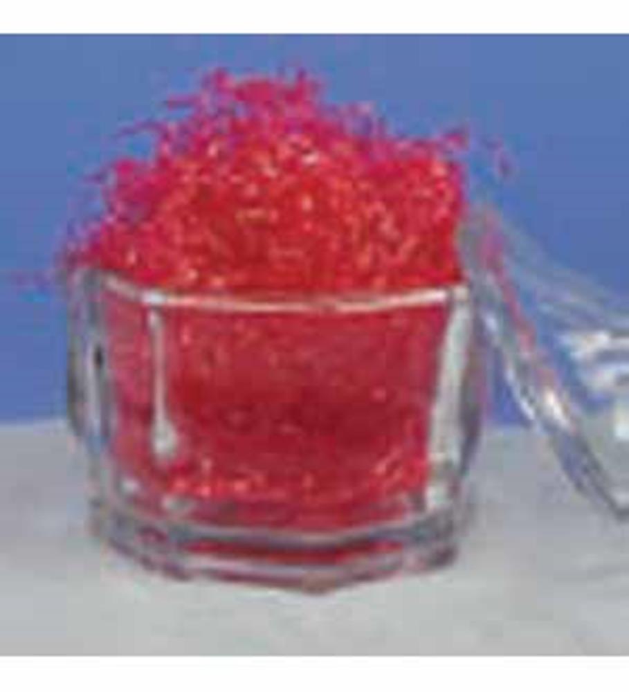 Clear glass jar filled with bright red decorative shredded paper, partially open lid.
