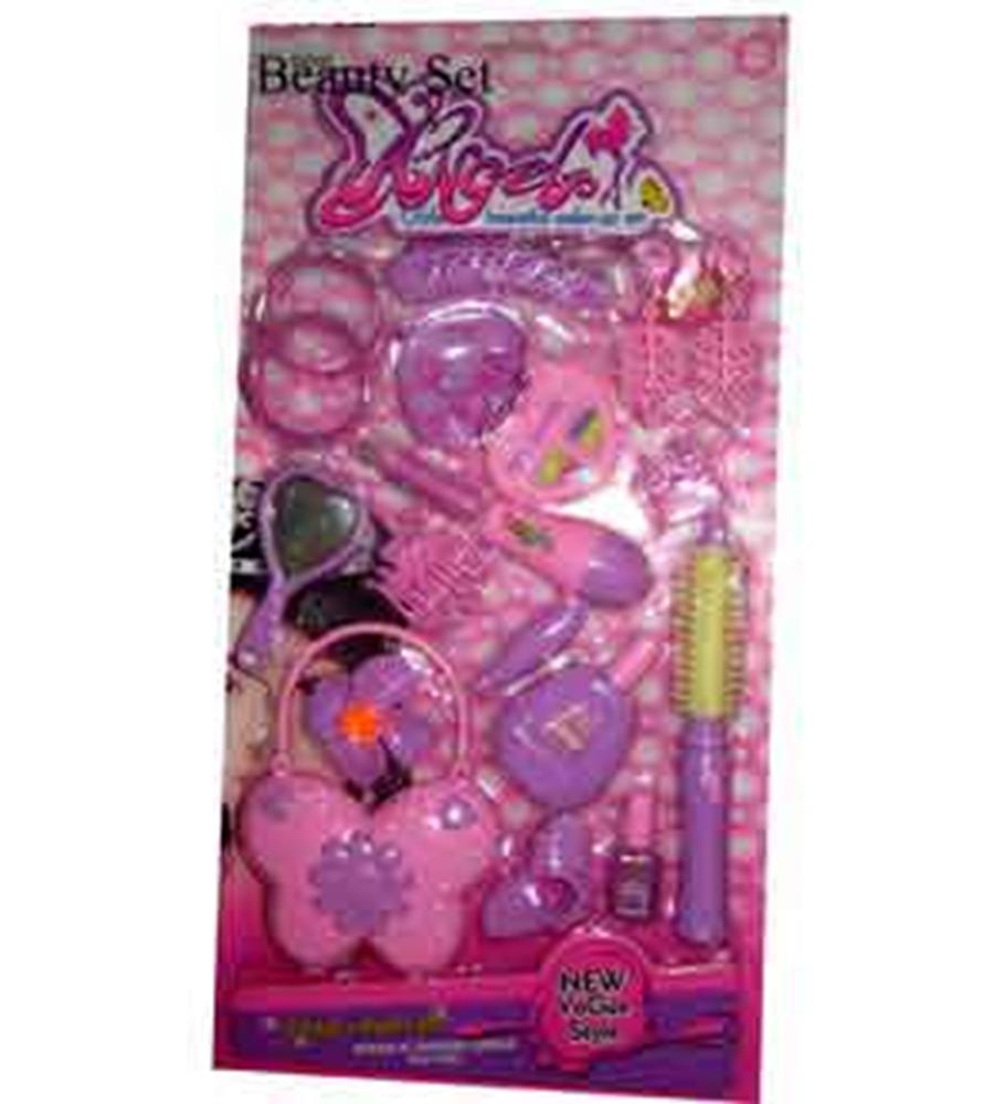 Pink plastic toy beauty set with comb, mirror, hairbrush, and accessories in butterfly-shaped packaging.