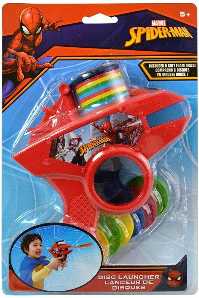 Red plastic Spiderman-themed foam disc launcher with a circular chamber and colorful foam discs, packaged on a.