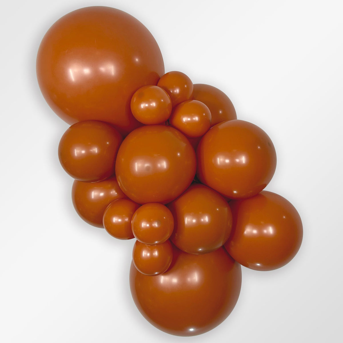 Sempertex Deluxe Sunset Orange latex balloon color cluster showing the shade across multiple balloon sizes