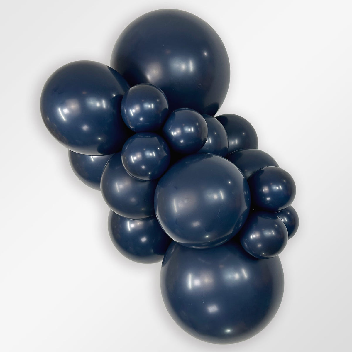 Sempertex Fashion Navy Blue latex balloon color cluster showing the shade across multiple balloon sizes