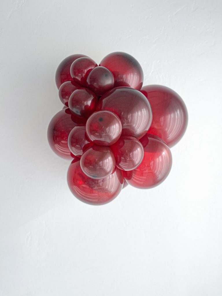 Tuftex Burgundy latex balloon color cluster showing the shade across multiple balloon sizes