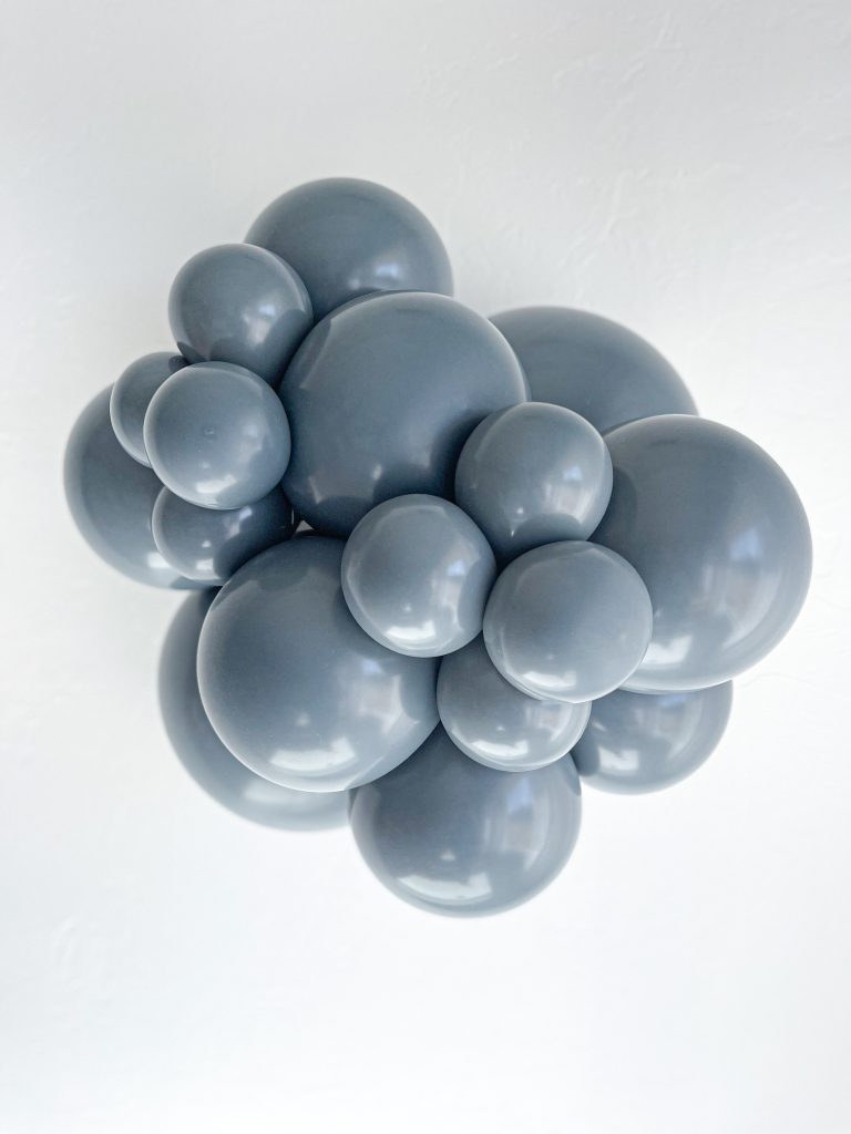 Tuftex Gray Smoke latex balloon color cluster showing the shade across multiple balloon sizes