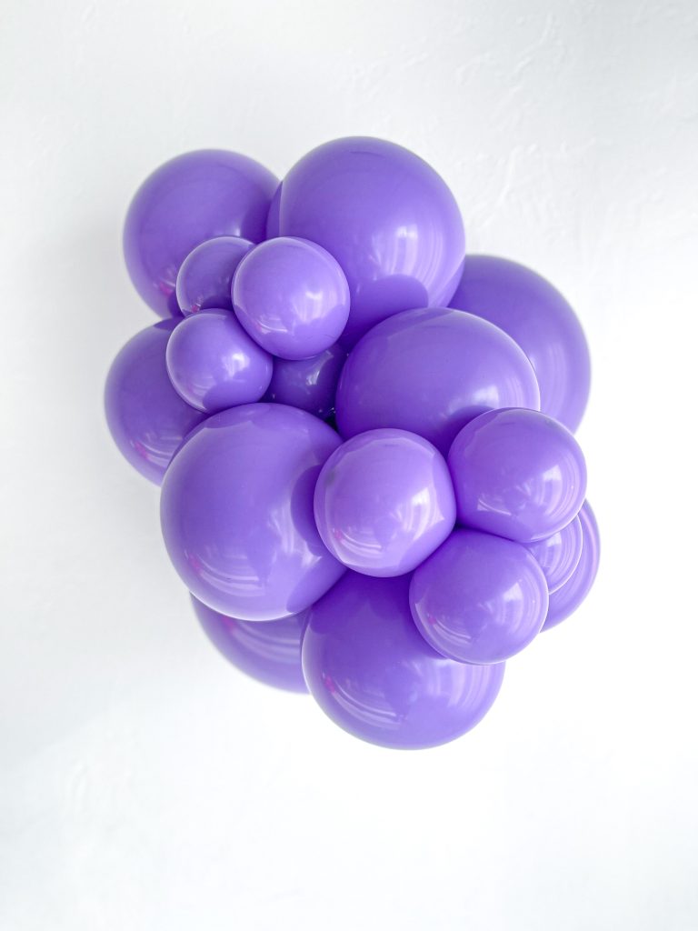 Tuftex Lavender latex balloon color cluster showing the shade across multiple balloon sizes