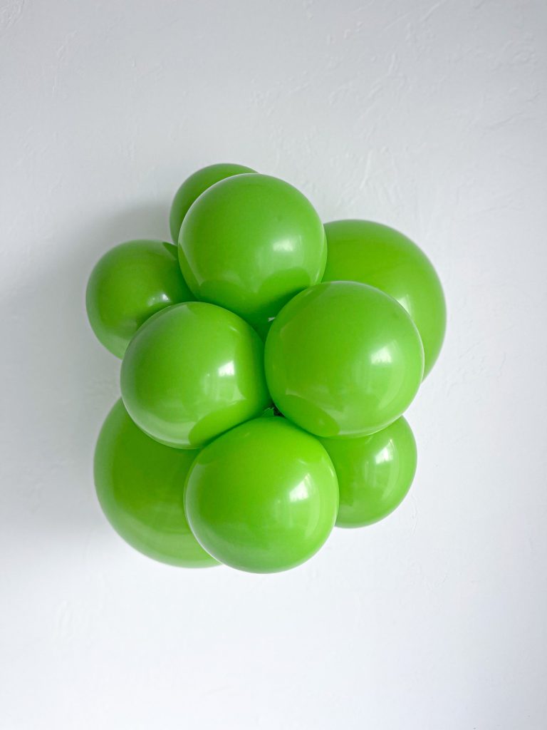 Tuftex Lime Green latex balloon color cluster showing the shade across multiple balloon sizes