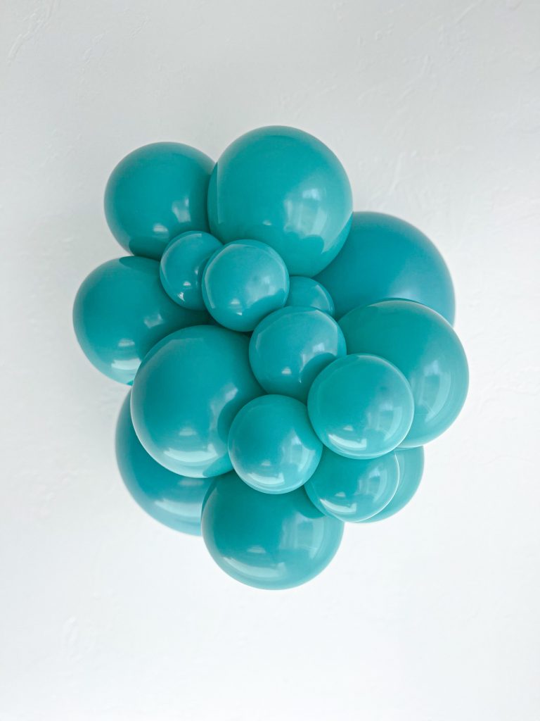 Tuftex Teal latex balloon color cluster showing the shade across multiple balloon sizes