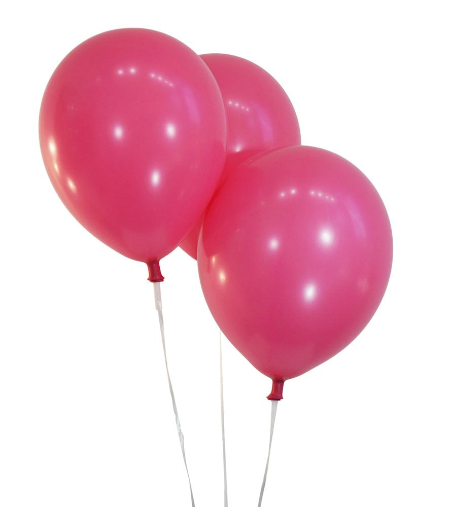 Three shiny fuchsia pink latex balloons inflated and tied with white strings.