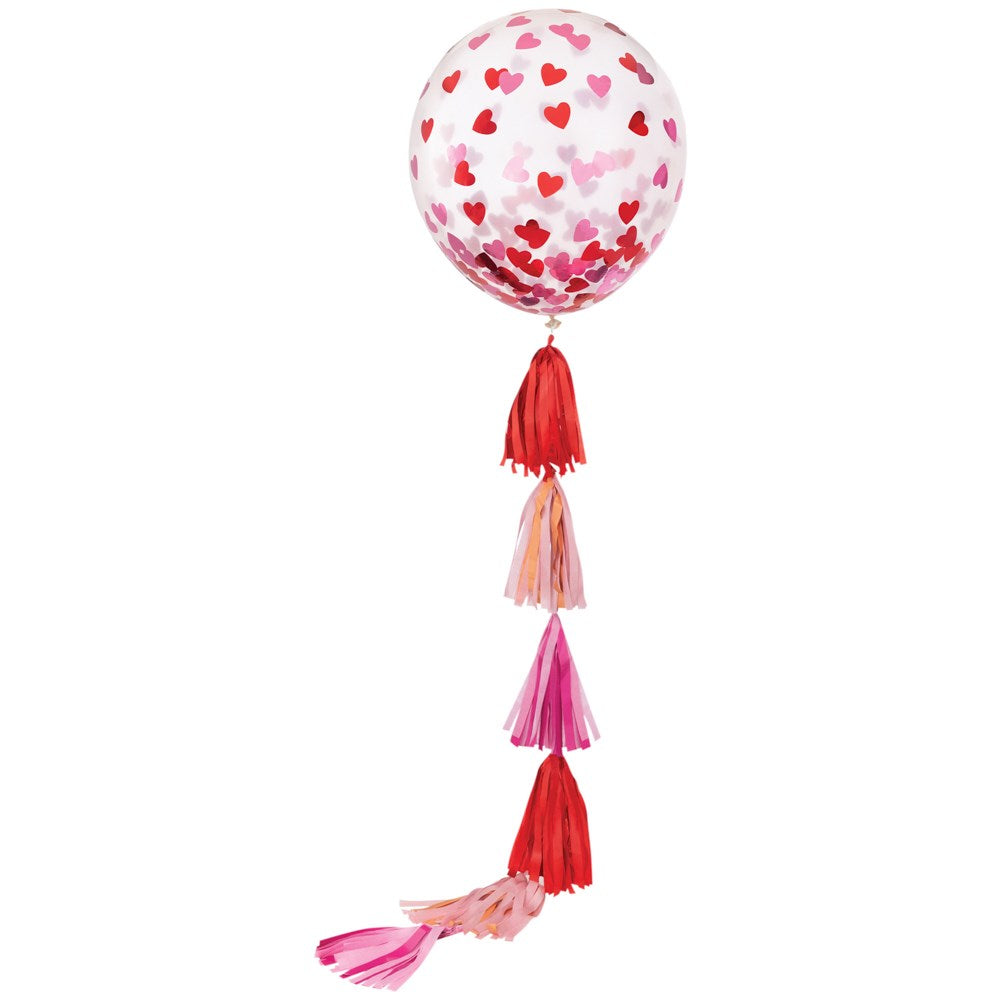 Transparent 24-inch balloon with red and pink hearts, attached to a long tassel tail in shades of red, pink, and peach.
