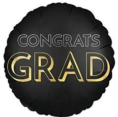 Round black satin foil balloon with "Congrats GRAD" in gold and white lettering, 28 inches, flat.