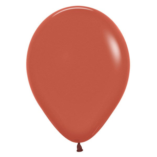 Terracotta-colored 5-inch round latex balloon with smooth, glossy surface and tied end.