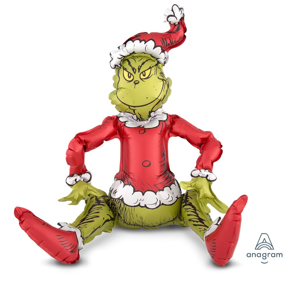 27-inch foil balloon shaped like the Grinch sitting, wearing a red Santa hat and jacket with white trim.