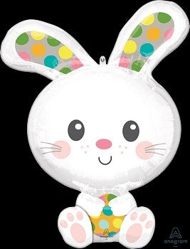 White foil balloon shaped like a bunny head with colorful polka dots inside ears and on feet.