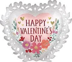 Heart-shaped foil balloon with white lace-like edges, pink center, floral accents, and "Happy Valentine's Day" text in red.
