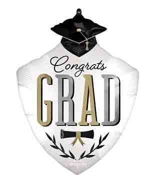 White shield-shaped foil balloon with a black graduation cap topper, "Congrats GRAD" text in gold and black, and laurel.