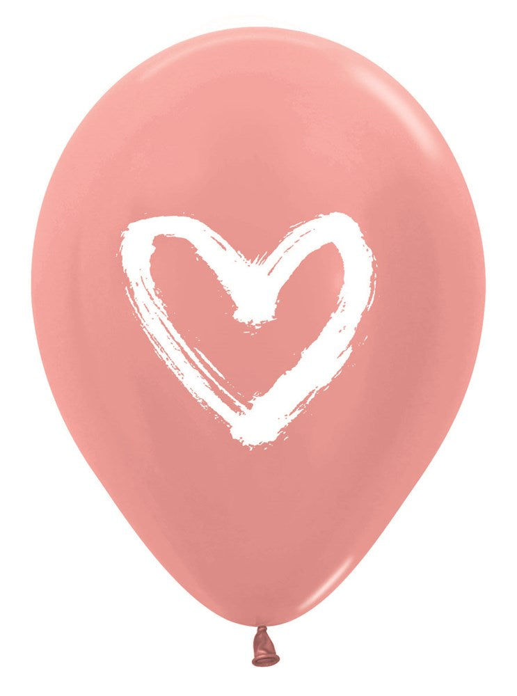 Pink latex balloon with a white painted heart design in the center.