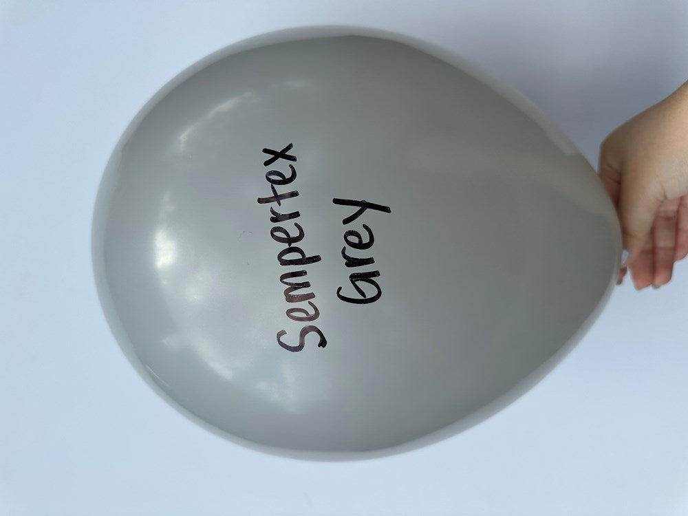 Glossy gray latex balloon inflated, 11 inches wide, with "Sempertex Grey" printed in black text.