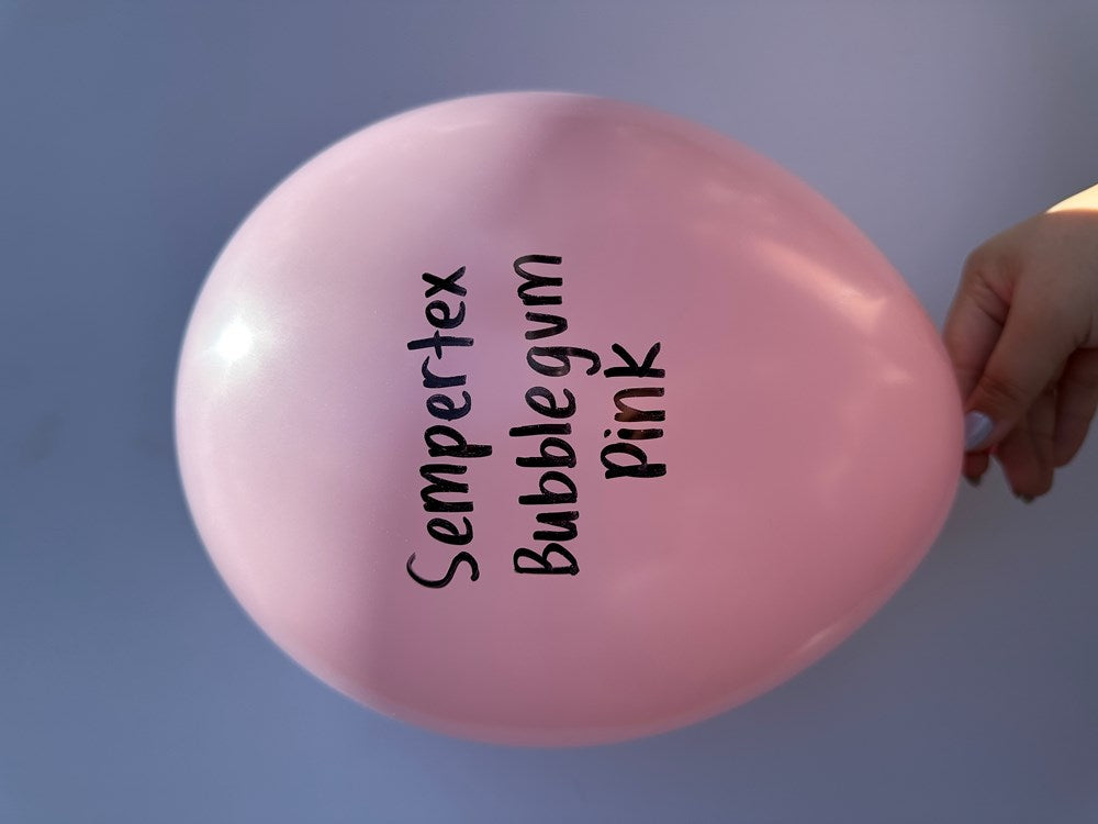 Glossy bubble gum pink latex balloon inflated, labeled with black text.