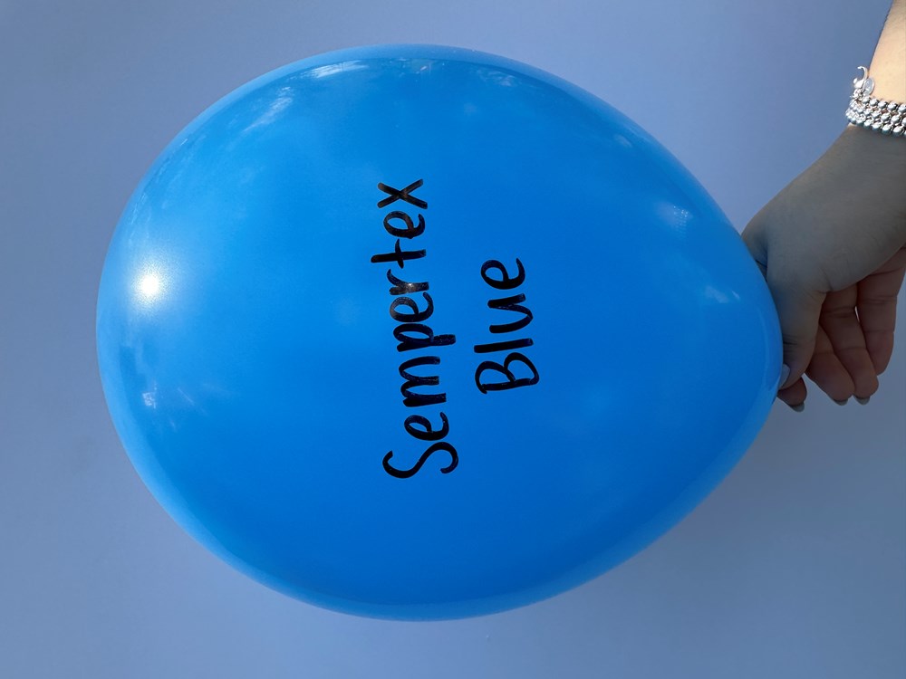 Bright blue 18-inch latex balloon with Sempertex Blue text, held by hand.