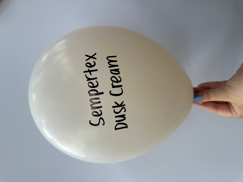 18-inch round latex balloon in a soft pastel cream color with "Sempertex Dusk Cream" printed in black text.