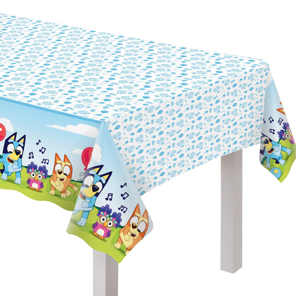 Rectangular blue and white table cover with Bluey character pattern and musical notes along the edges.