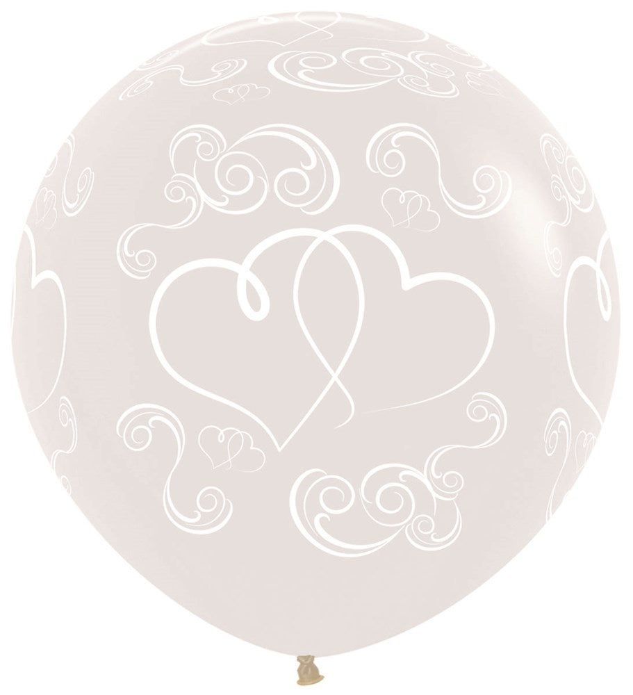 24-inch clear latex balloon with white crossed hearts and decorative swirls print.