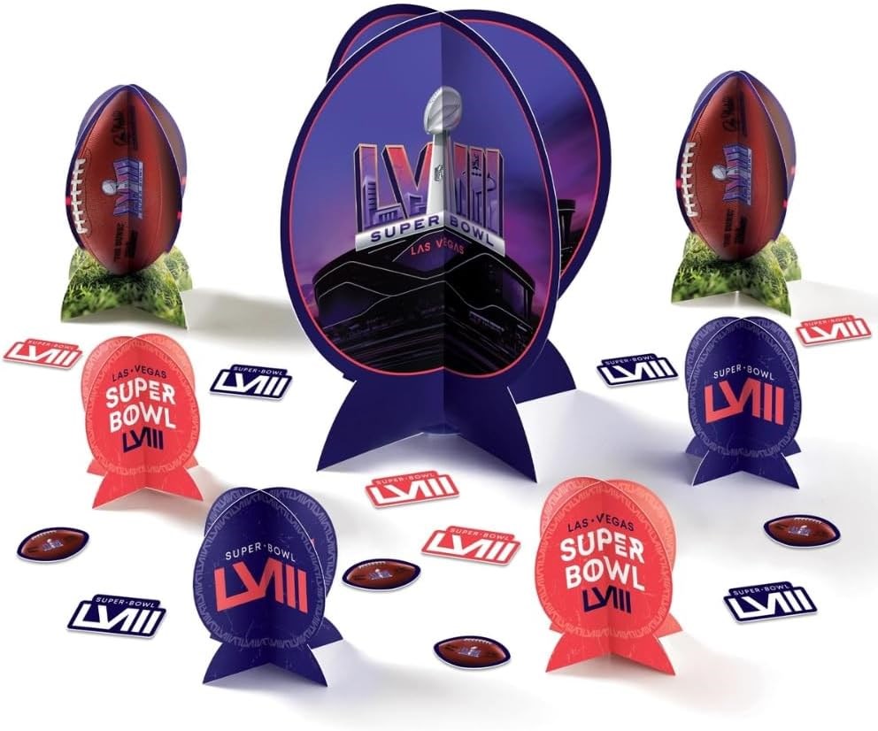 Super Bowl LVII table decoration kit with purple and red football helmets, football replicas, and themed confetti on a green