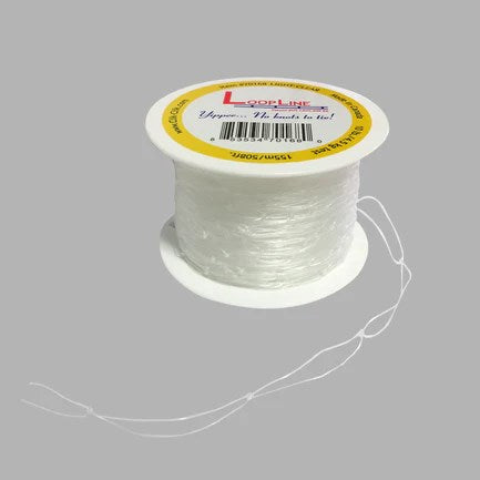 Clear nylon thread spool with yellow and white label, thin translucent string wound tightly.