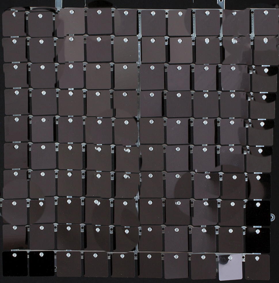 Black 12x12 inch wall panel covered in shiny sequins arranged in a grid pattern.