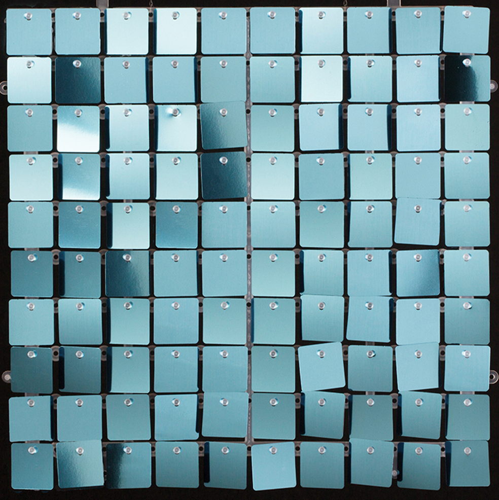 Blue sequin wall panel with 12x12 inch square tiles creating a shimmering effect.