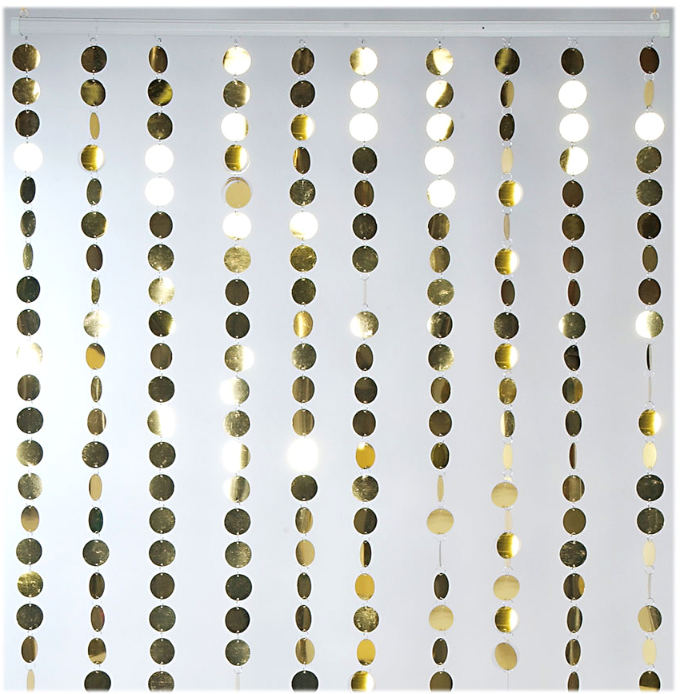 Gold metallic circular discs strung vertically to create a shimmering curtain panel.