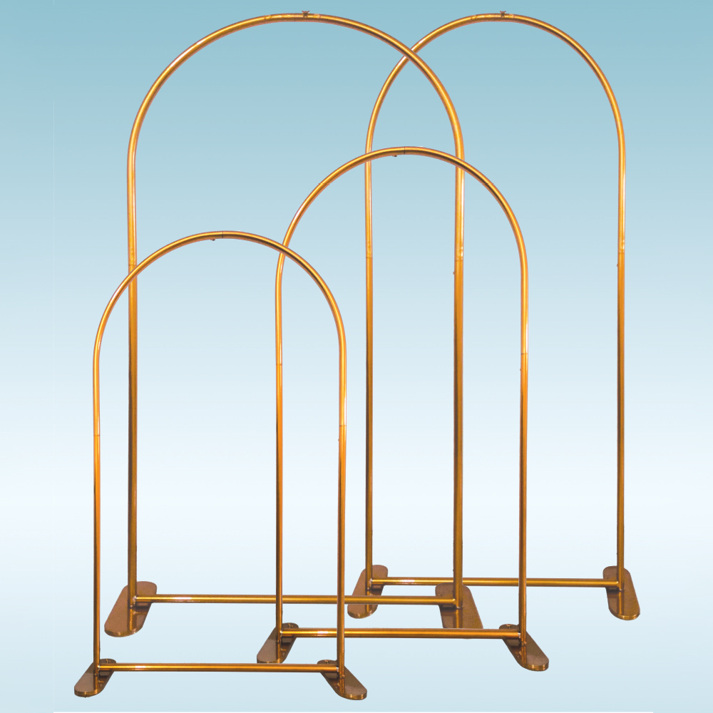 Set of four gold arch-shaped metal backdrops in varying heights and widths with flat weighted bases.