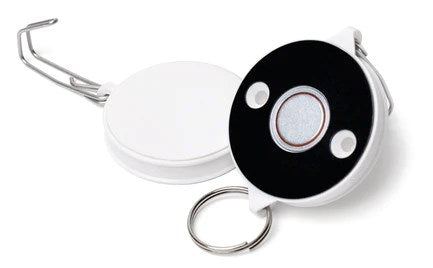 Round retractable white and black key holder with metal clip and ring, compact design.