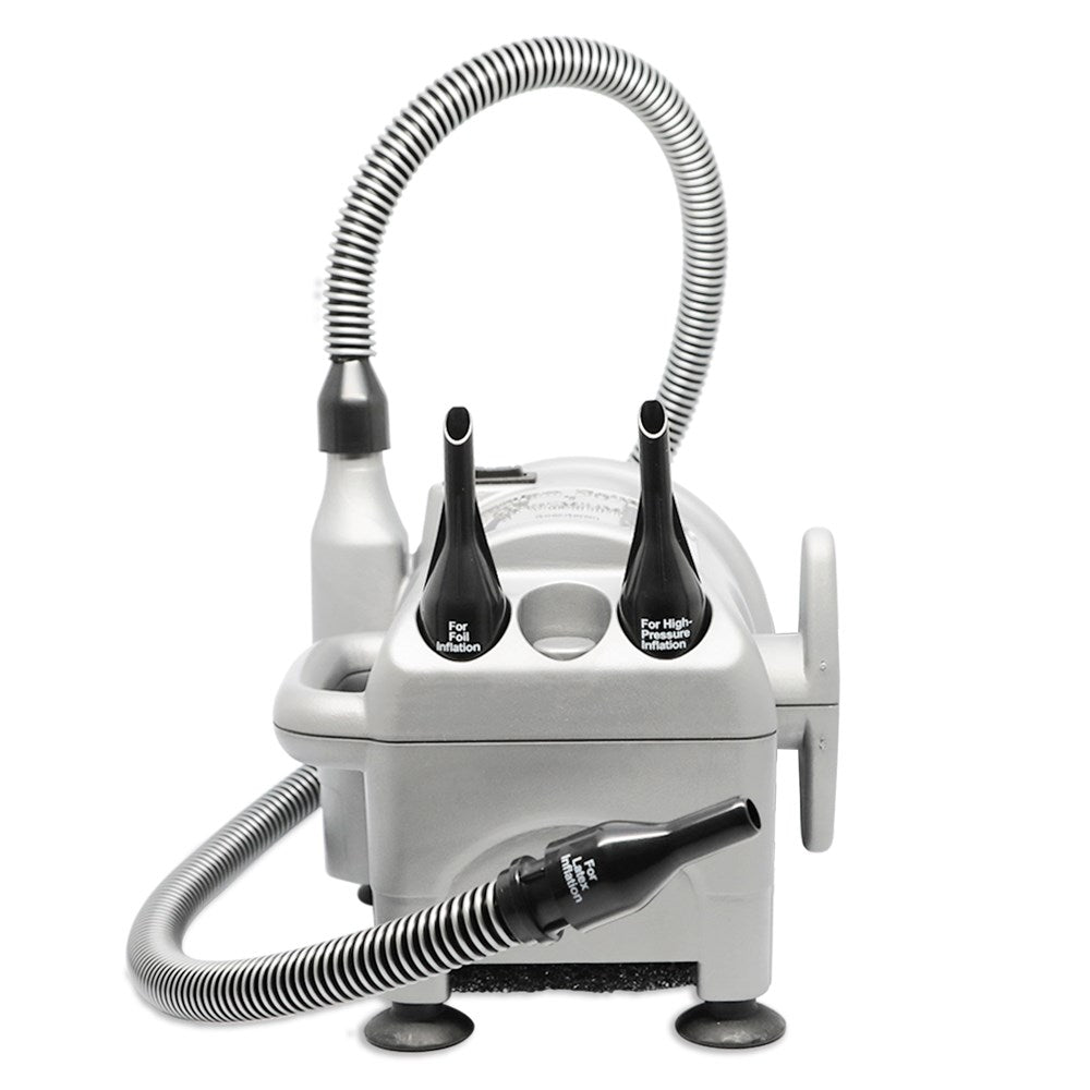 Compact gray balloon inflator with flexible silver hoses and black nozzles attached on top and front.