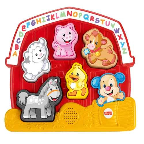 Colorful plastic farm animal puzzle with removable pieces featuring a sheep, pig, cow, donkey, chick, and a smiling dog.